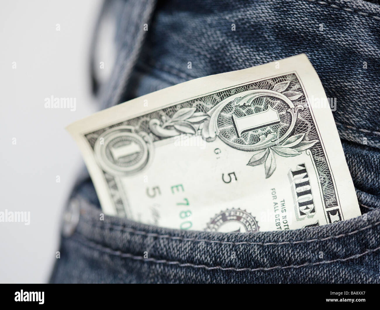 Close up of dollar bill in pocket Stock Photo