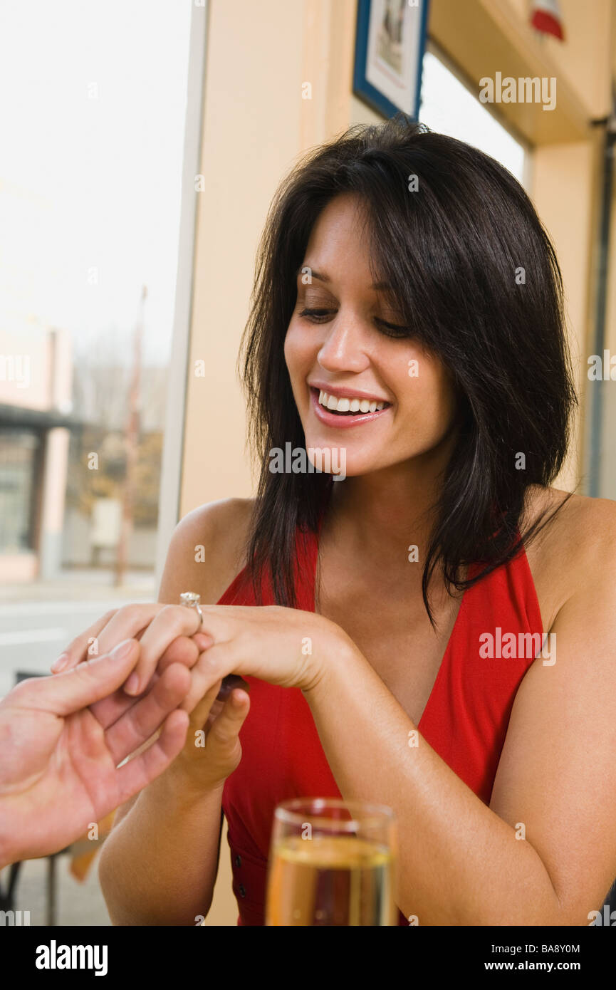 Man giving girlfriend engagement ring in restaurant Stock Photo Alamy