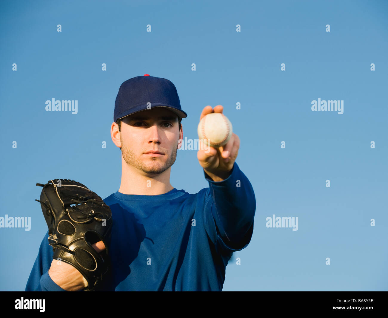 Baseball player holding ball Stock Photo Alamy