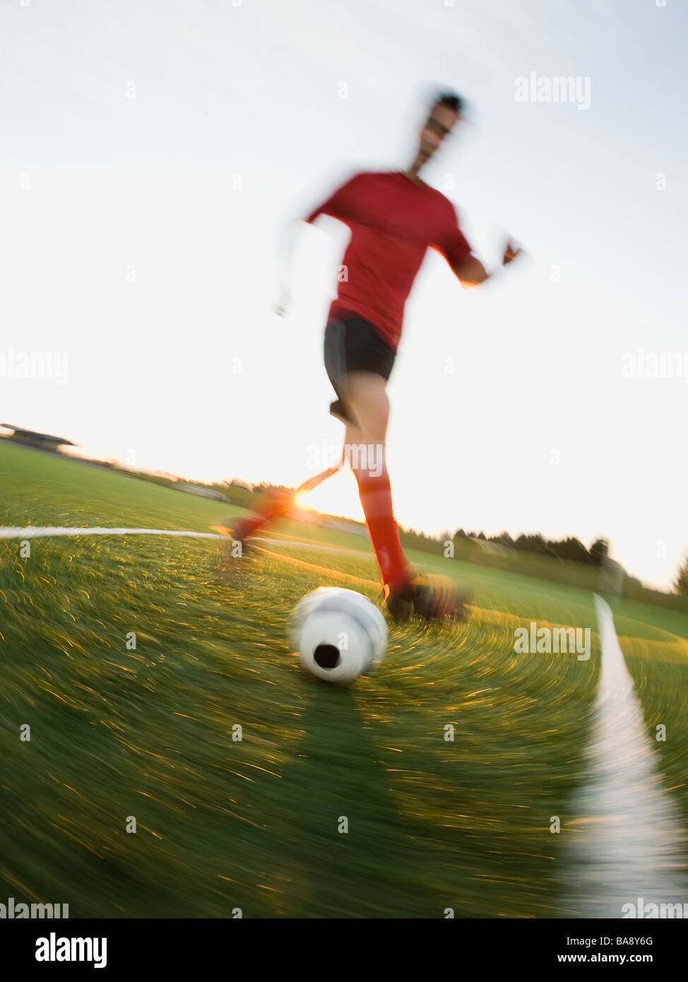 Soccer player dribbling ball Stock Photo Alamy