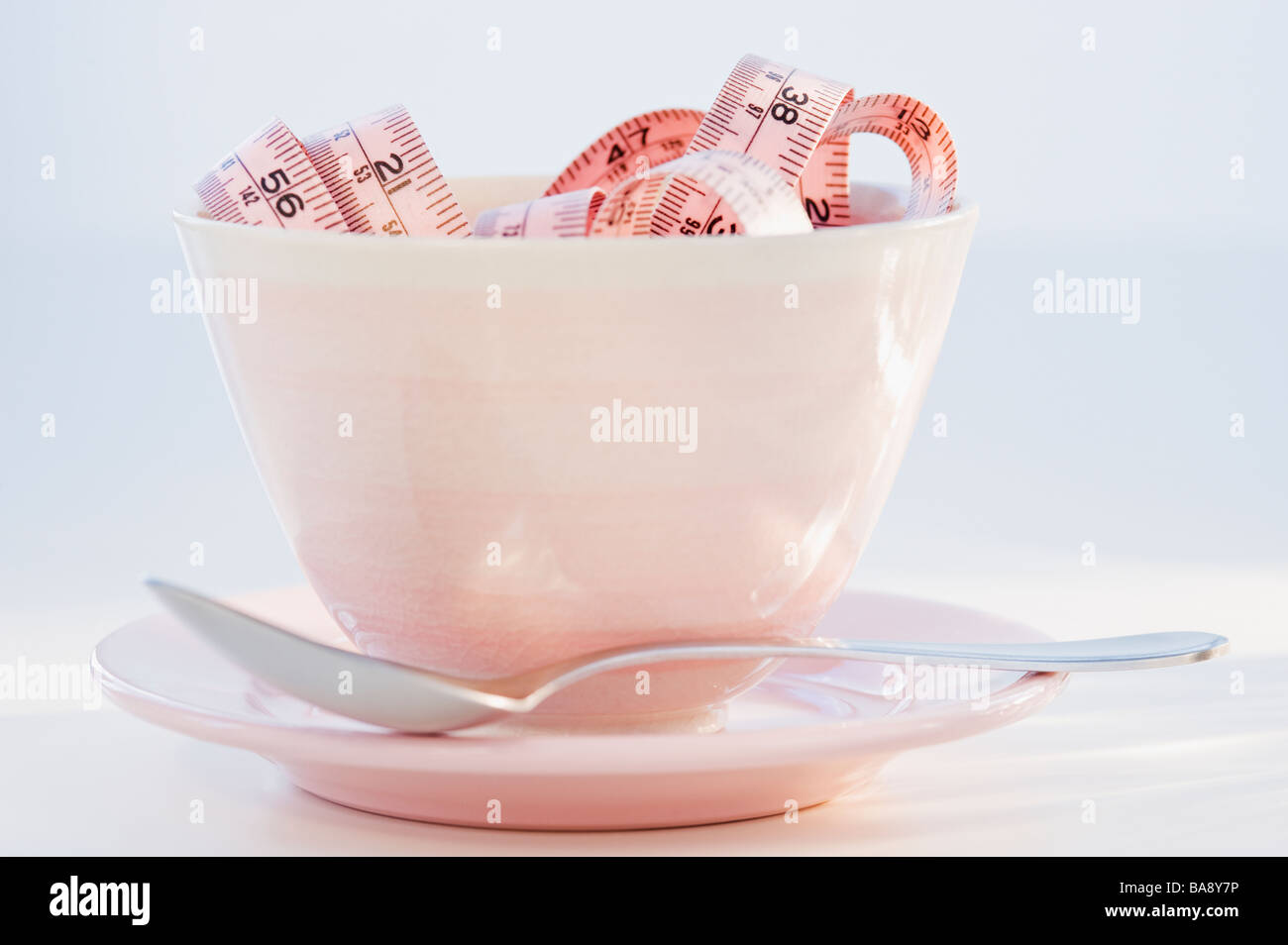 Tape measure in bowl Stock Photo Alamy