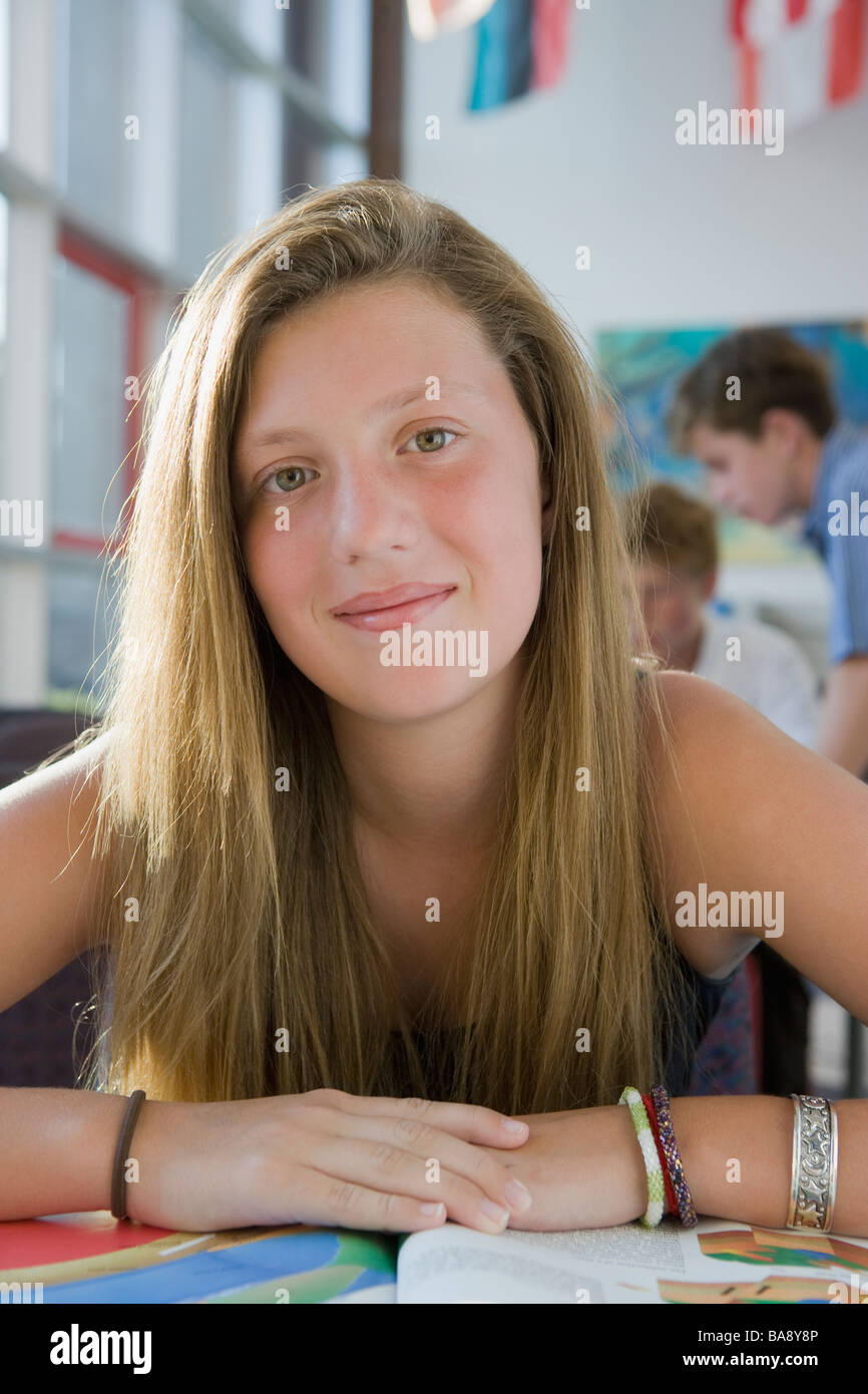 Girl posing in library Stock Photo - Alamy