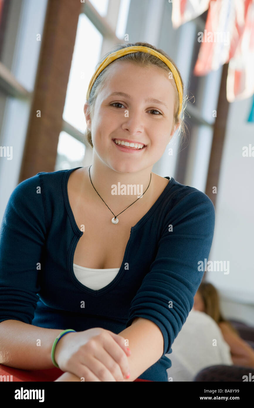 Girl posing in library Stock Photo - Alamy