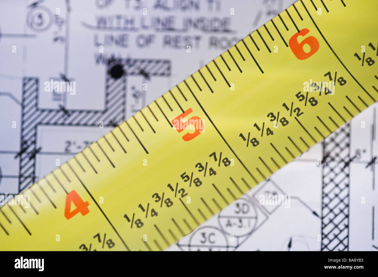 Close up of blueprint and tape measure Stock Photo