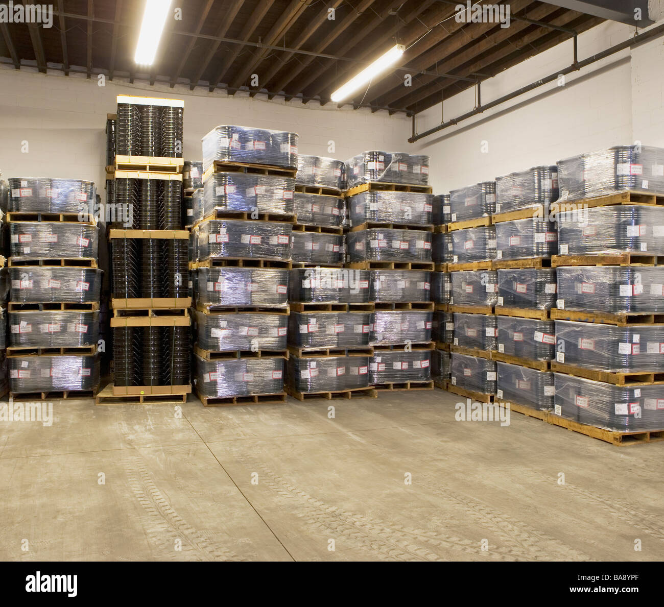 Stacks of pallets in warehouse Stock Photo Alamy