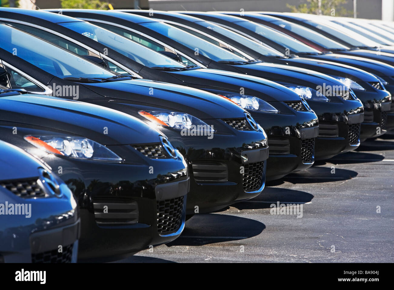 Row of cars in car lot Stock Photo