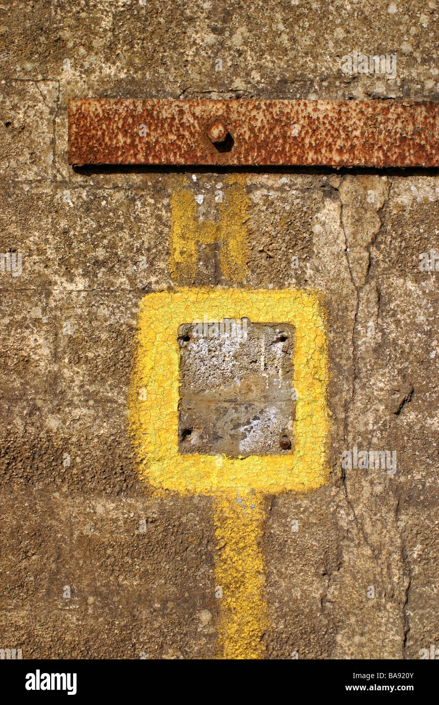 Yellow square painted thing on a wall somewhere Stock Photo