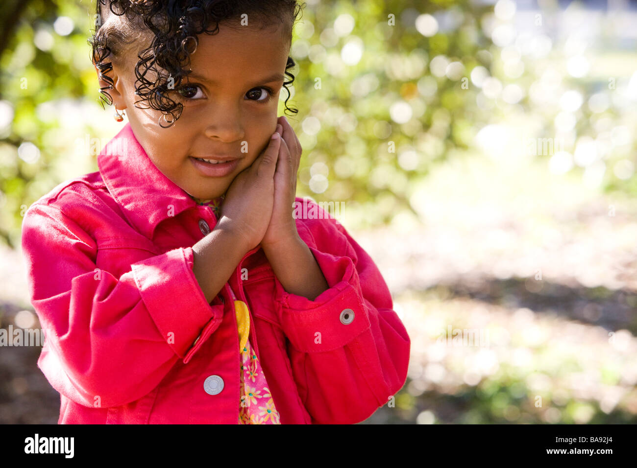 Portrait of African American girl in park Stock Photo - Alamy