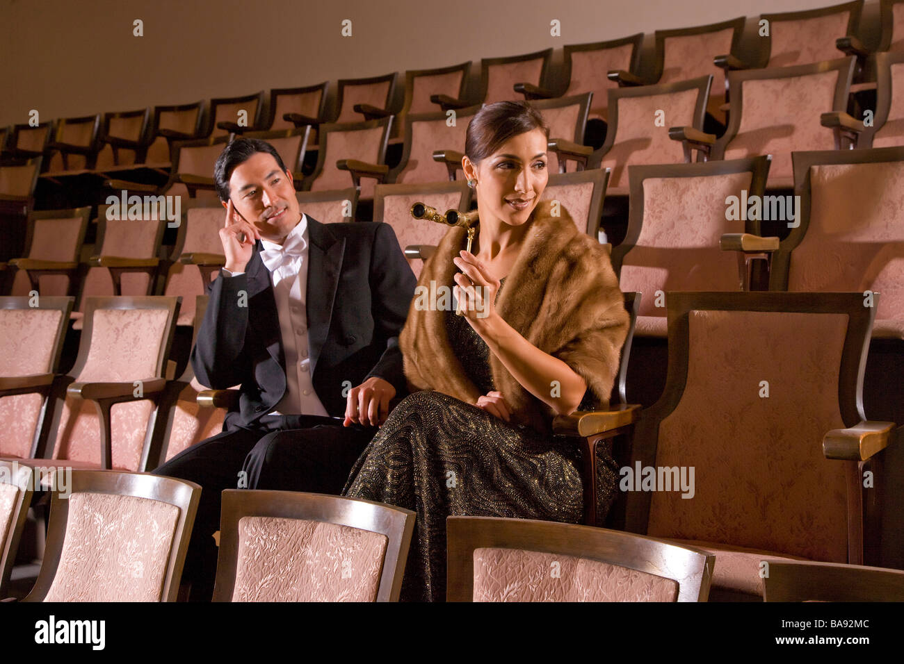 Elegant multi-racial couple on a date at the opera Stock Photo - Alamy