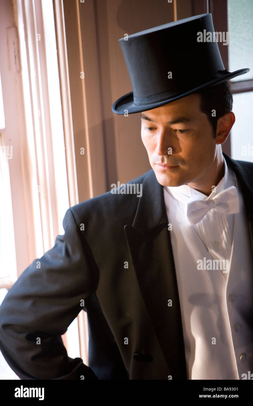 Asian man in tuxedo and top hat Stock Photo - Alamy