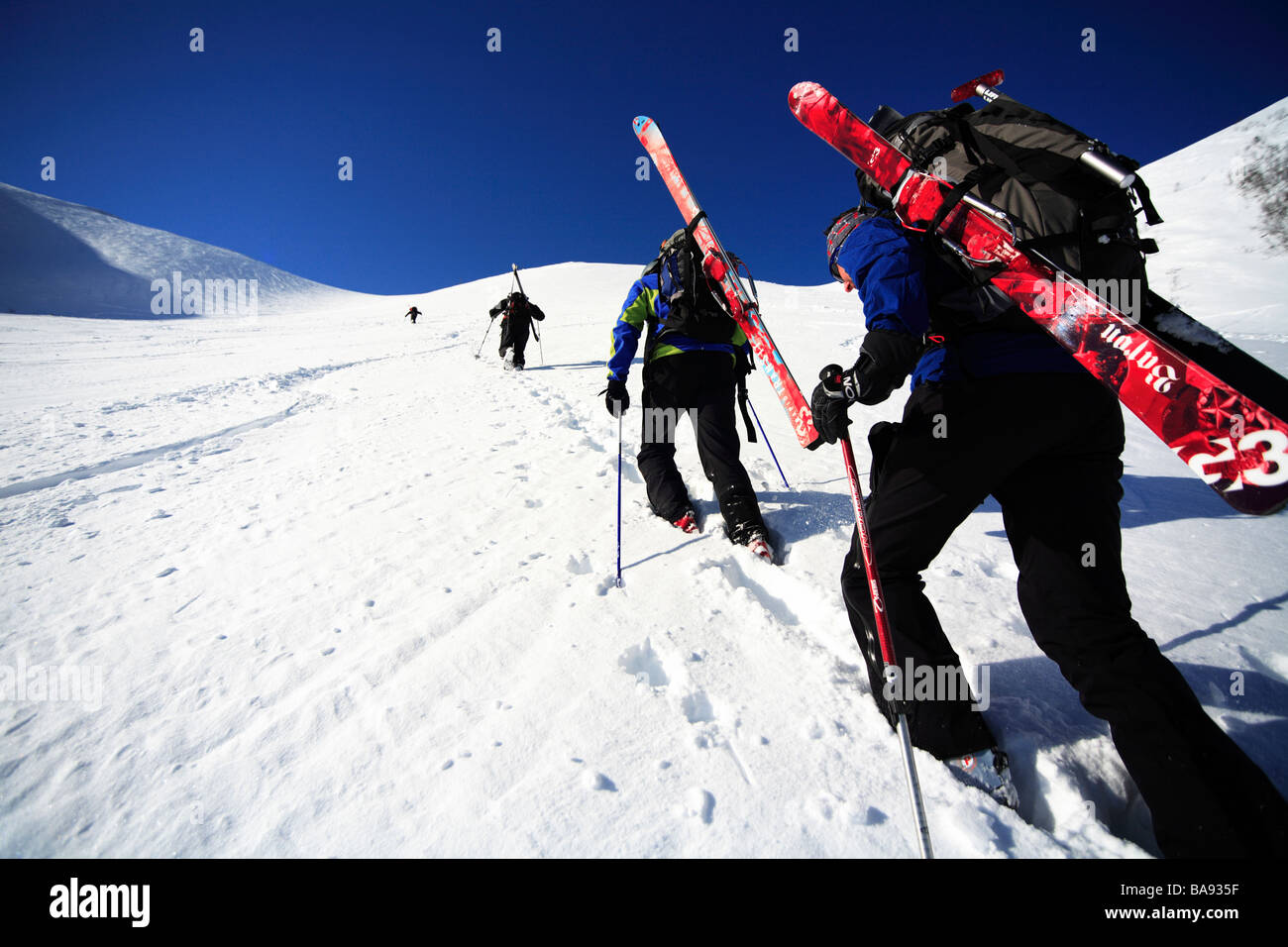 Skiers climbing a mountain Lapland Sweden Stock Photo