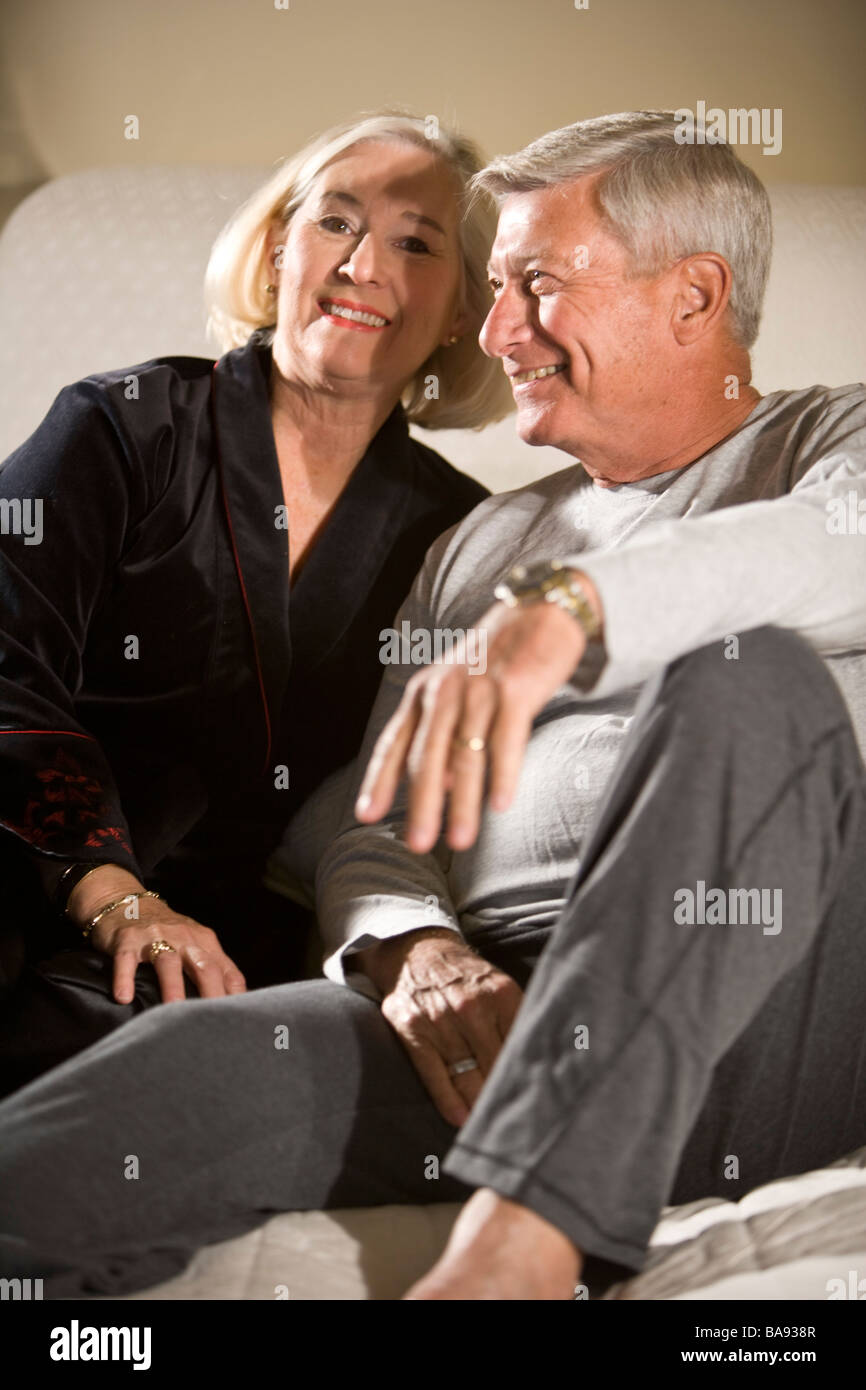 Portrait of senior couple relaxing in bedroom Stock Photo - Alamy