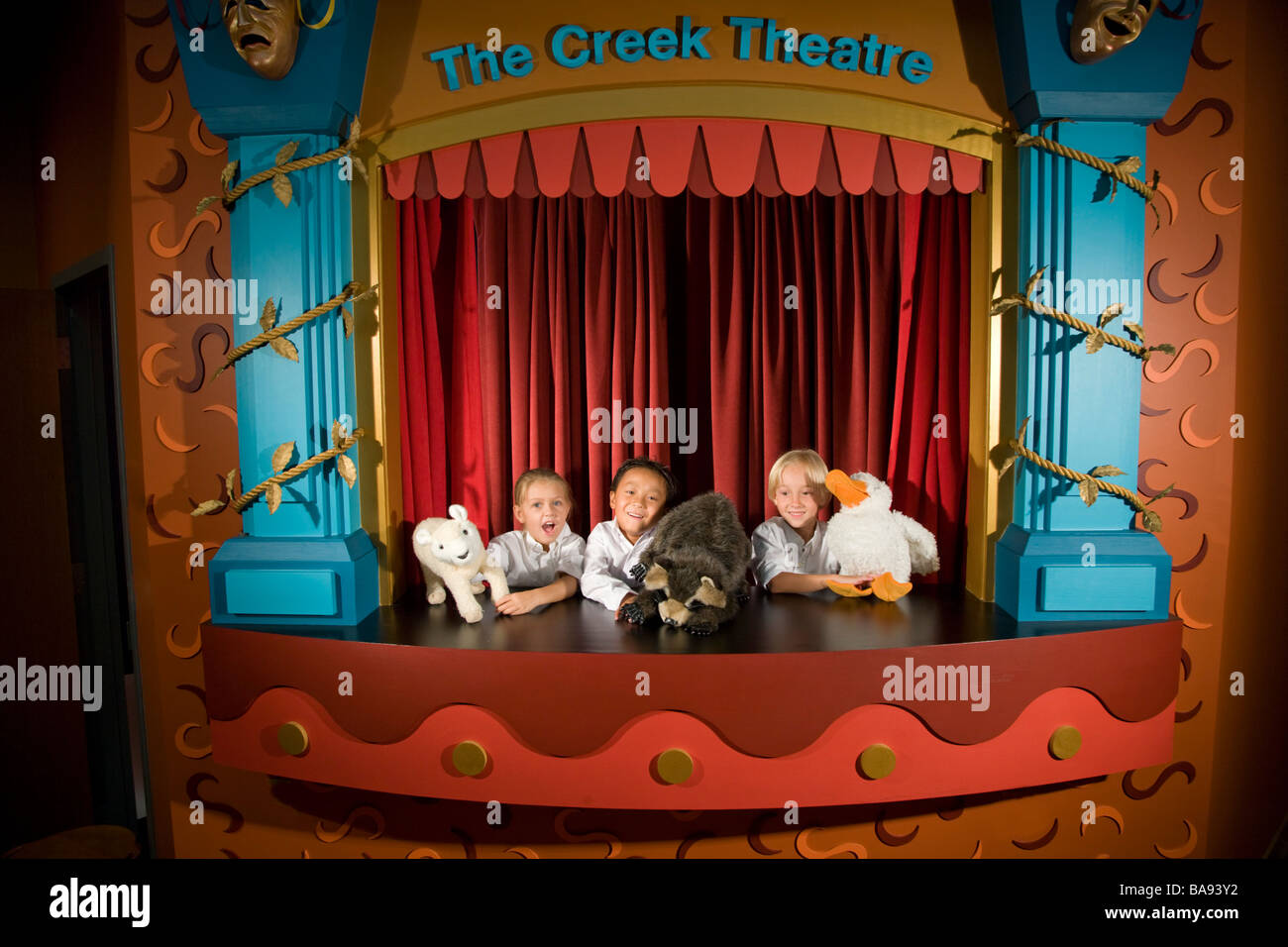 School kids doing puppet show in theatre at library Stock Photo Alamy