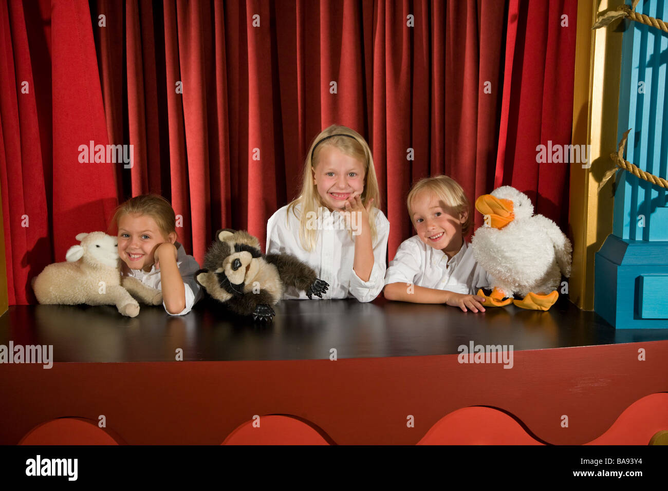 School kids doing puppet show in theatre at library Stock Photo Alamy