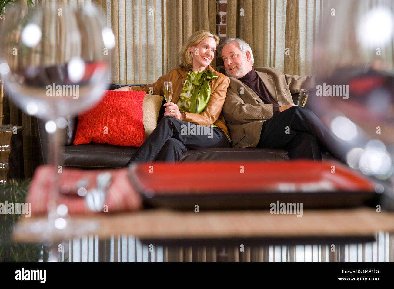 Romantic couple sitting sofa hi-res stock photography and images - Alamy