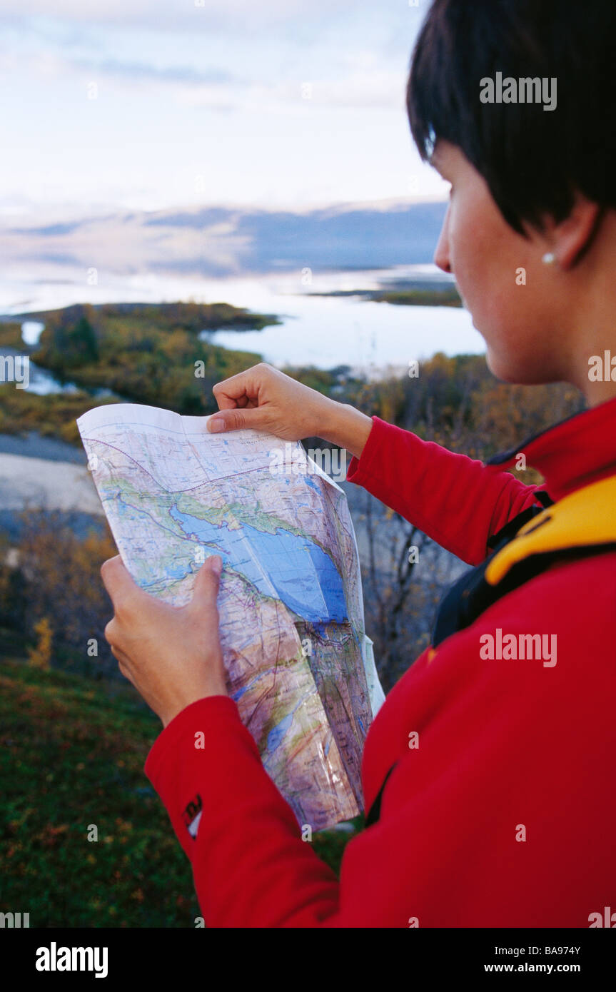 Woman reading a map Stock Photo - Alamy