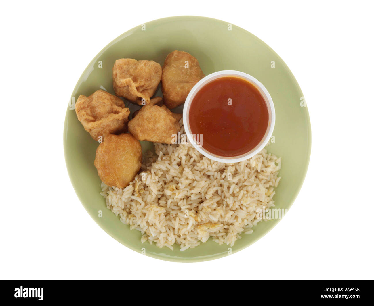 Freshly Cooked Authentic Chinese Style Sweet and Sour Chicken Balls With Rice Isolated Against A White Background With No People And A Clipping Path Stock Photo