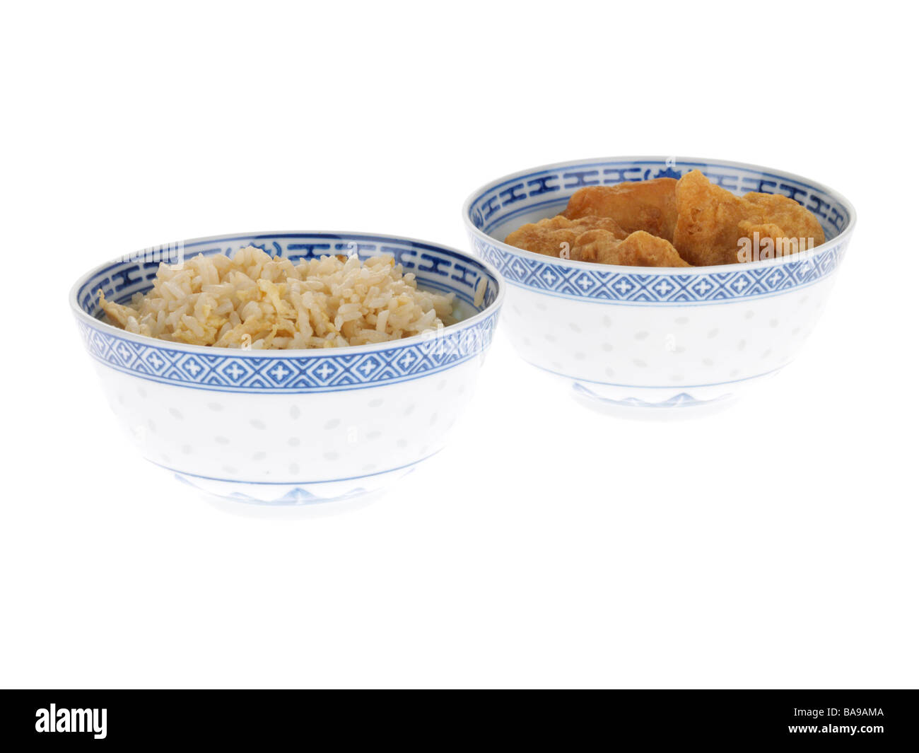 Freshly Cooked Authentic Chinese Style Sweet and Sour Chicken Balls With Rice Isolated Against A White Background With No People And A Clipping Path Stock Photo