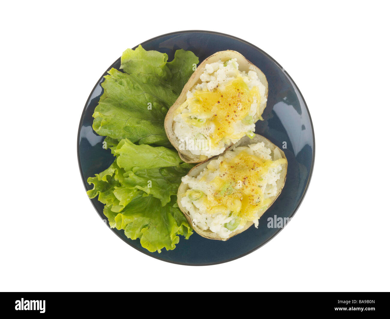 Freshly Baked Jacket Potatoes Topped With Melted Cheese And A Salad Garnish Isolated Against A White Background With No People And A Clipping Path Stock Photo