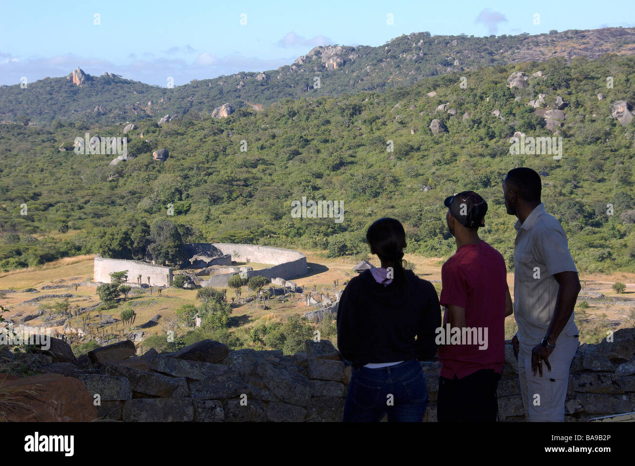 Tourists marvel at the size of Zimbabwe's Great Zimbabwe Ruins, the