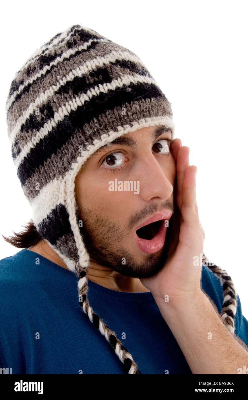 shocked young man wearing winter hat Stock Photo Alamy