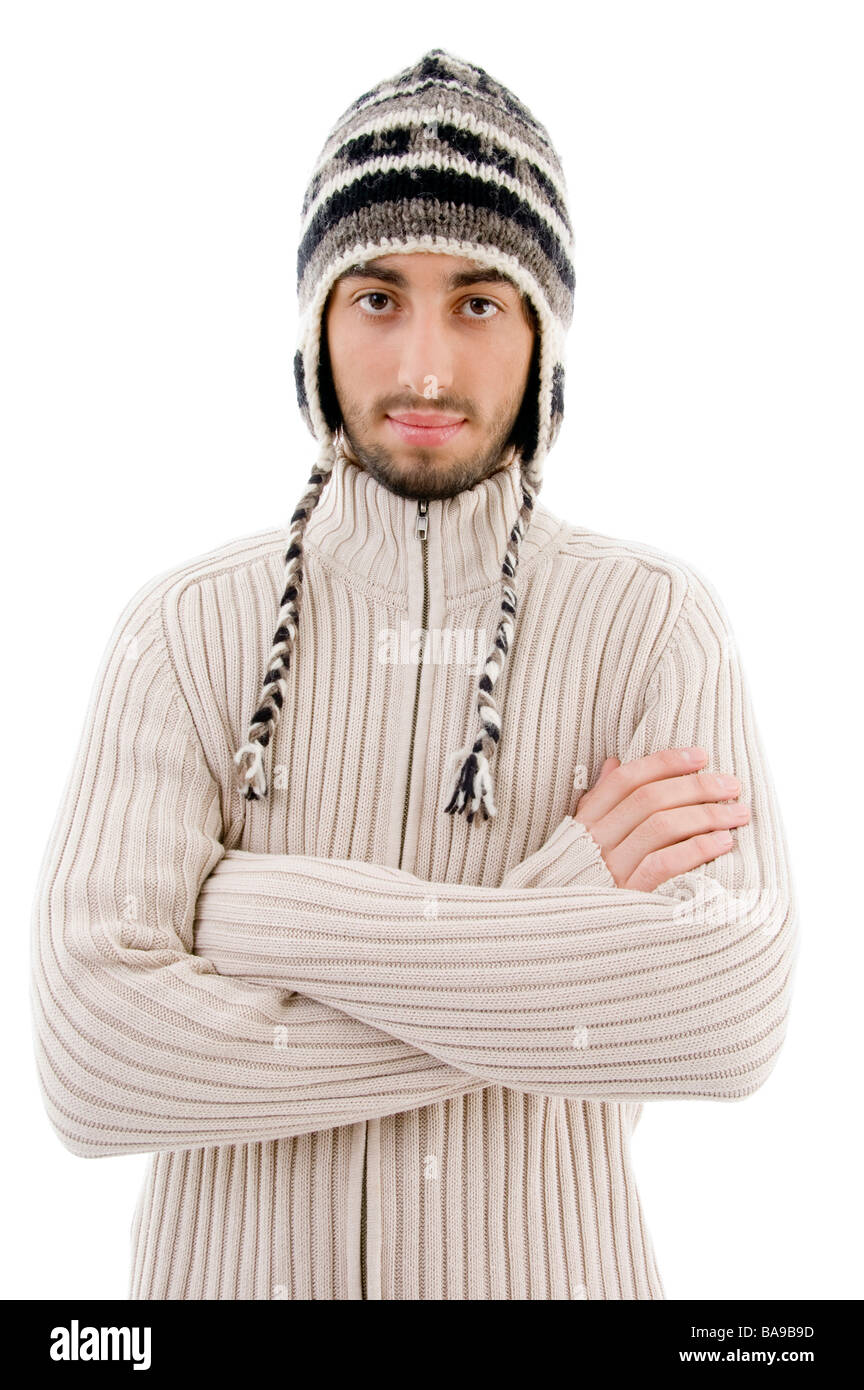 handsome man wearing woolen cap and posing with crossed arms Stock