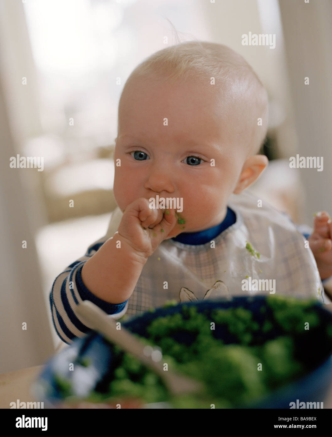 A baby eating, Sweden. Stock Photo