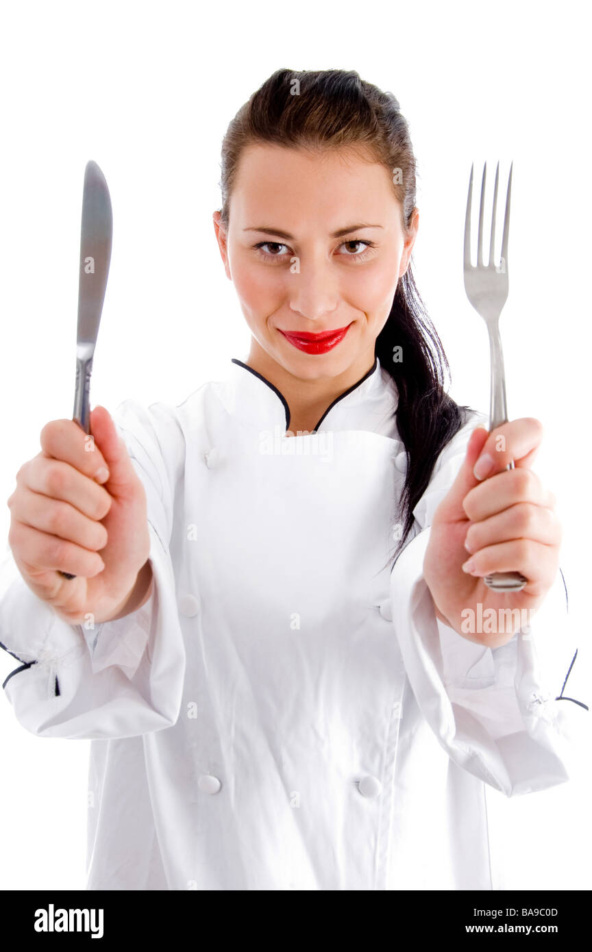 chef holding fork and knife Stock Photo Alamy