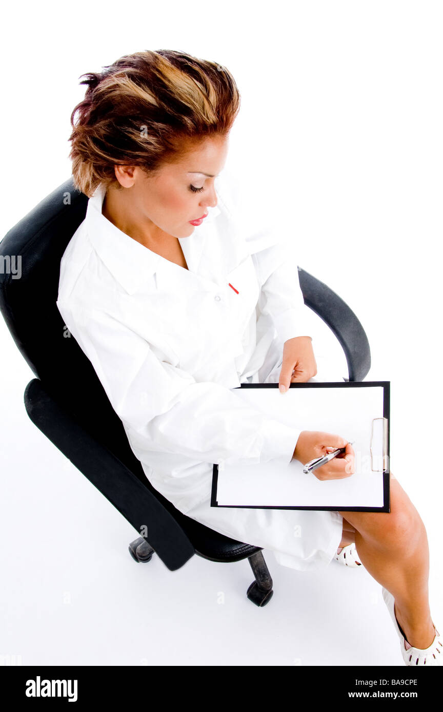 female doctor writing on notepad Stock Photo - Alamy