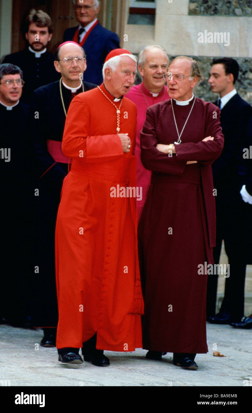 The Archbishop of Westminster Cardinal Basil Hume talking with the Archbishop of Canterbury Dr Robert Runcie Circa 1990s Stock Photo