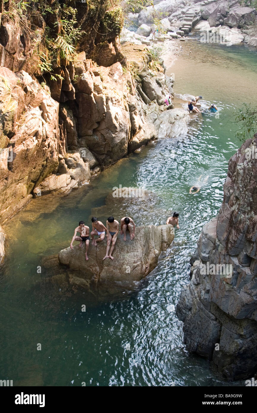 People swimming in a natural pool at a river in Nankun nature reserve in Guangdong in China. Stock Photo