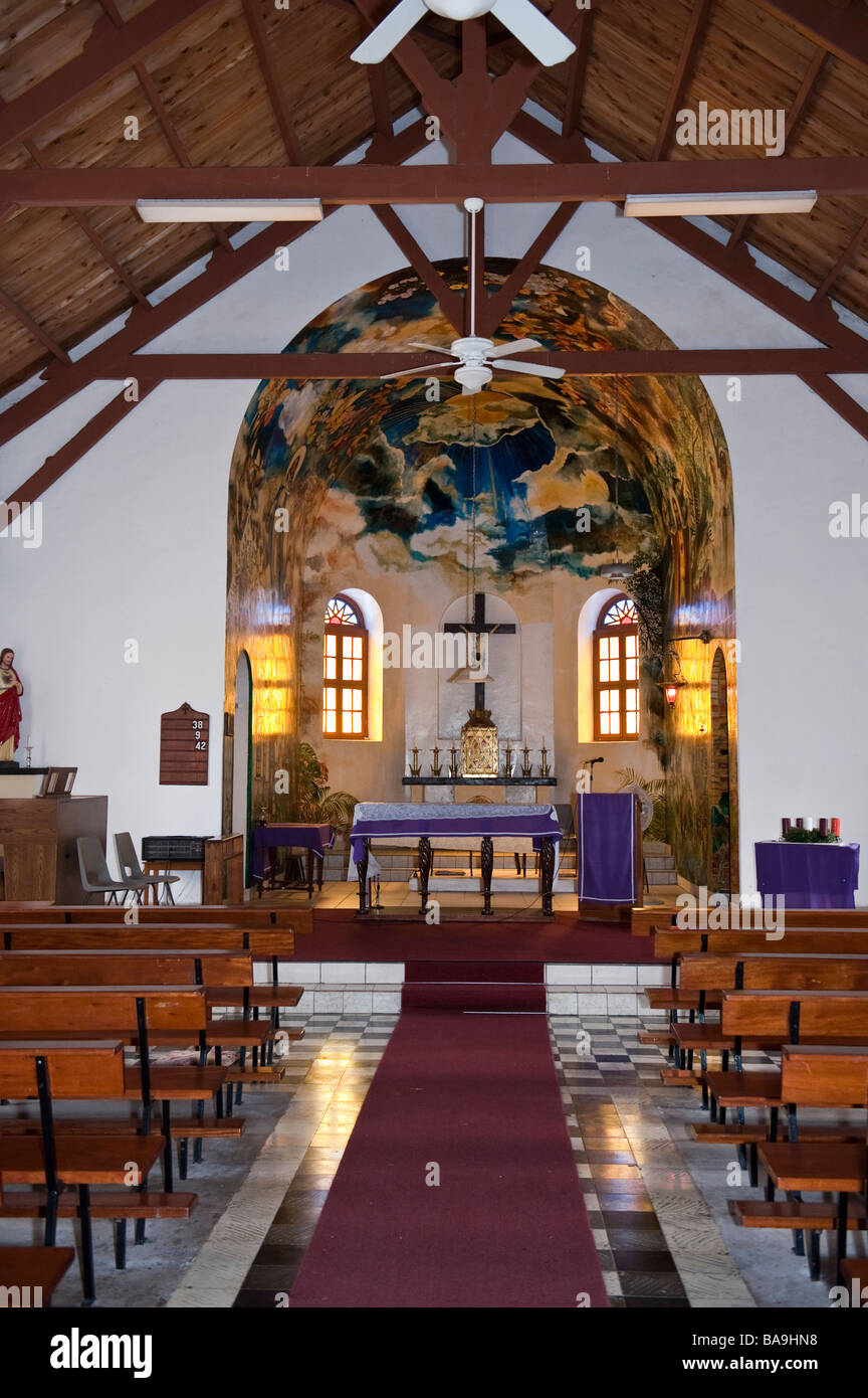 Interior view of Sacred Heart Roman Catholic Church in The Bottom, Saba with painted mural by Heleen Comet in the apse Stock Photo