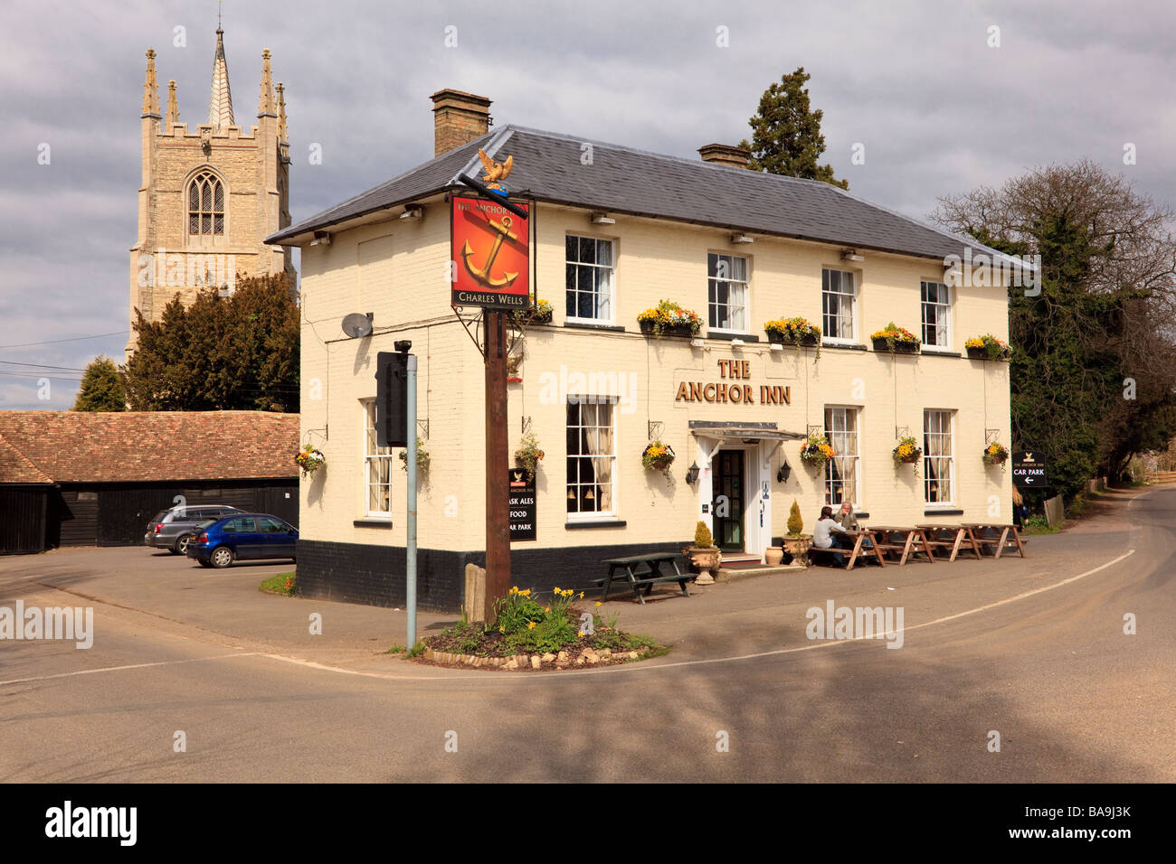 The Anchor Inn, Great Barford, Bedfordshire, Standing on a Road Junction with outside Drinkers Stock Photo