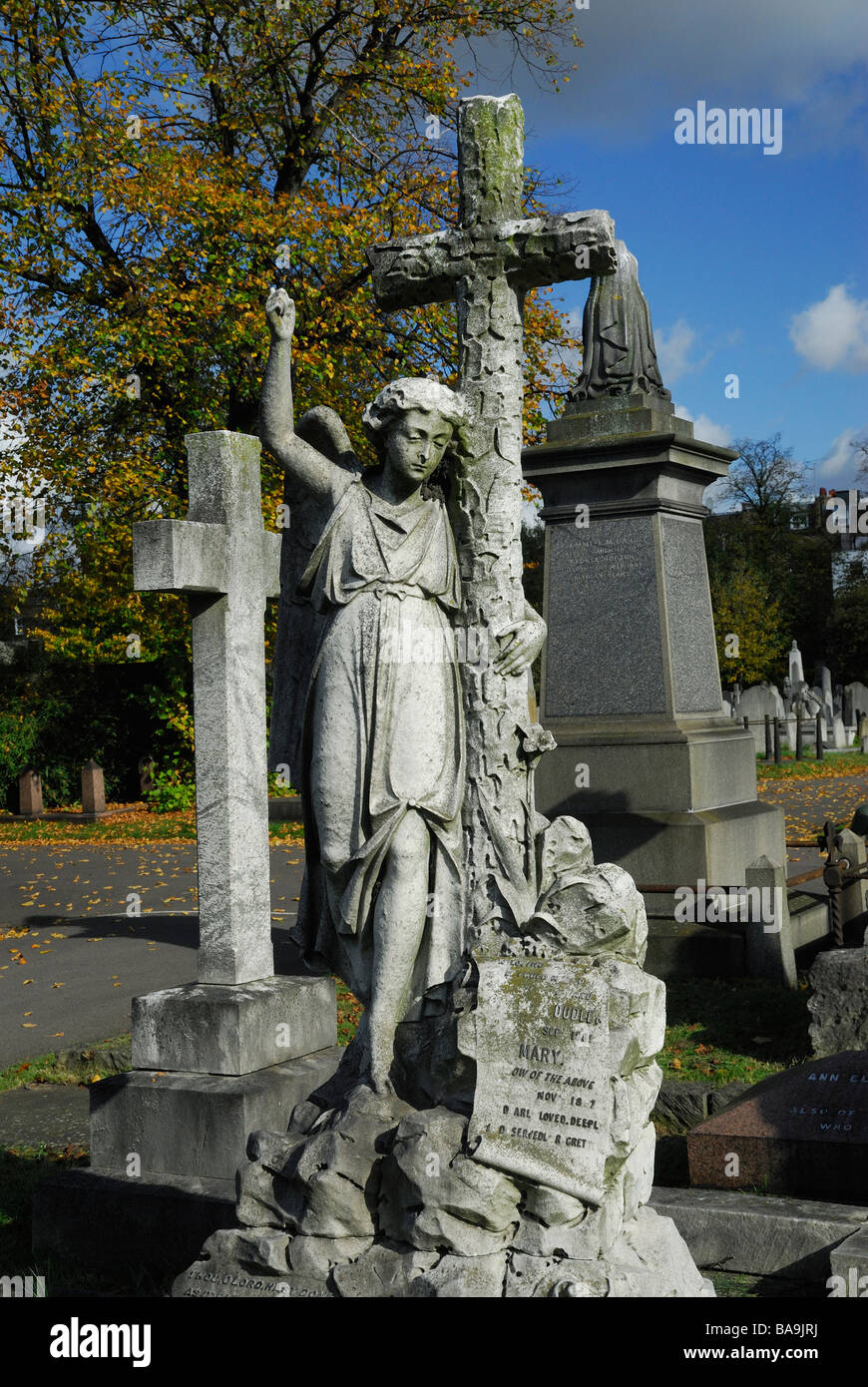 Stone angel onb tomb in Brompton Cemetery London Stock Photo