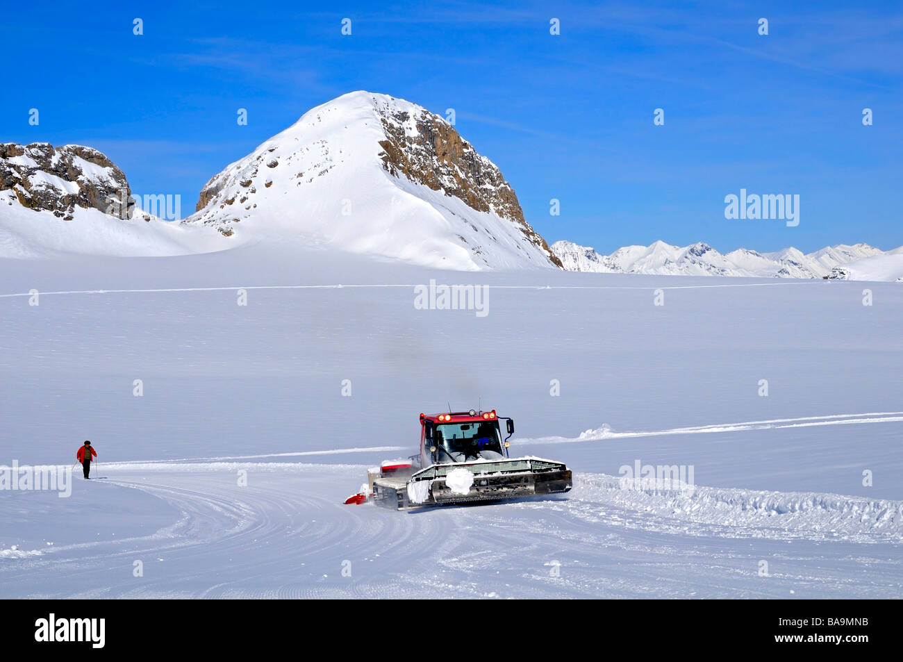 PistenBully Kässbohrer snow processing machine in action on the Plaine Morte glacier, Crans Montana, Switzerland Stock Photo