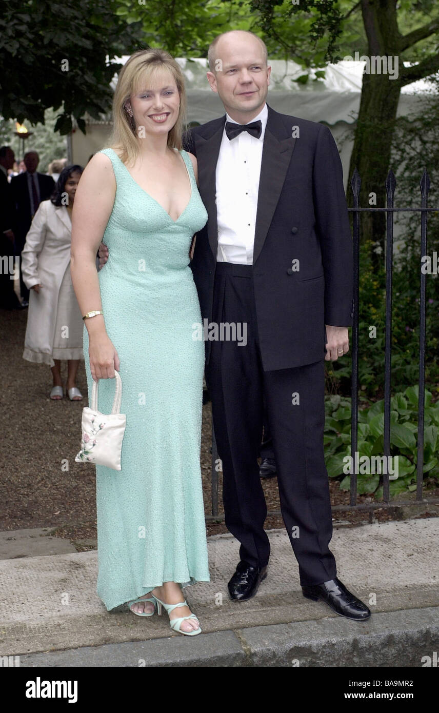 CONSERVATIVE POLITICIAN WILLIAM HAGUE AND WIFE FFION AT A SOCIETY SUMMER PARTY IN CHELSEA LONDON Stock Photo