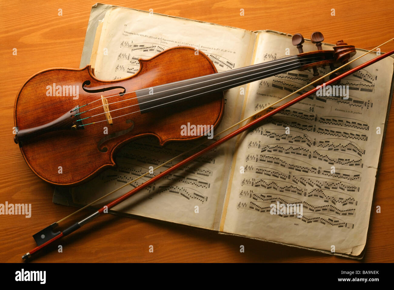 violin with violin bow on a sheet music Stock Photo