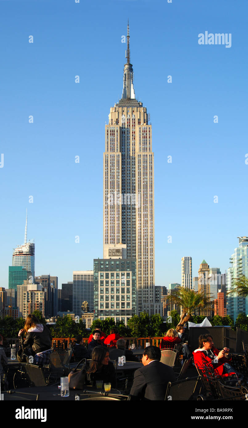 The State Empire Building overtops all other high rise buildings in Manhattan, New York, USA Stock Photo