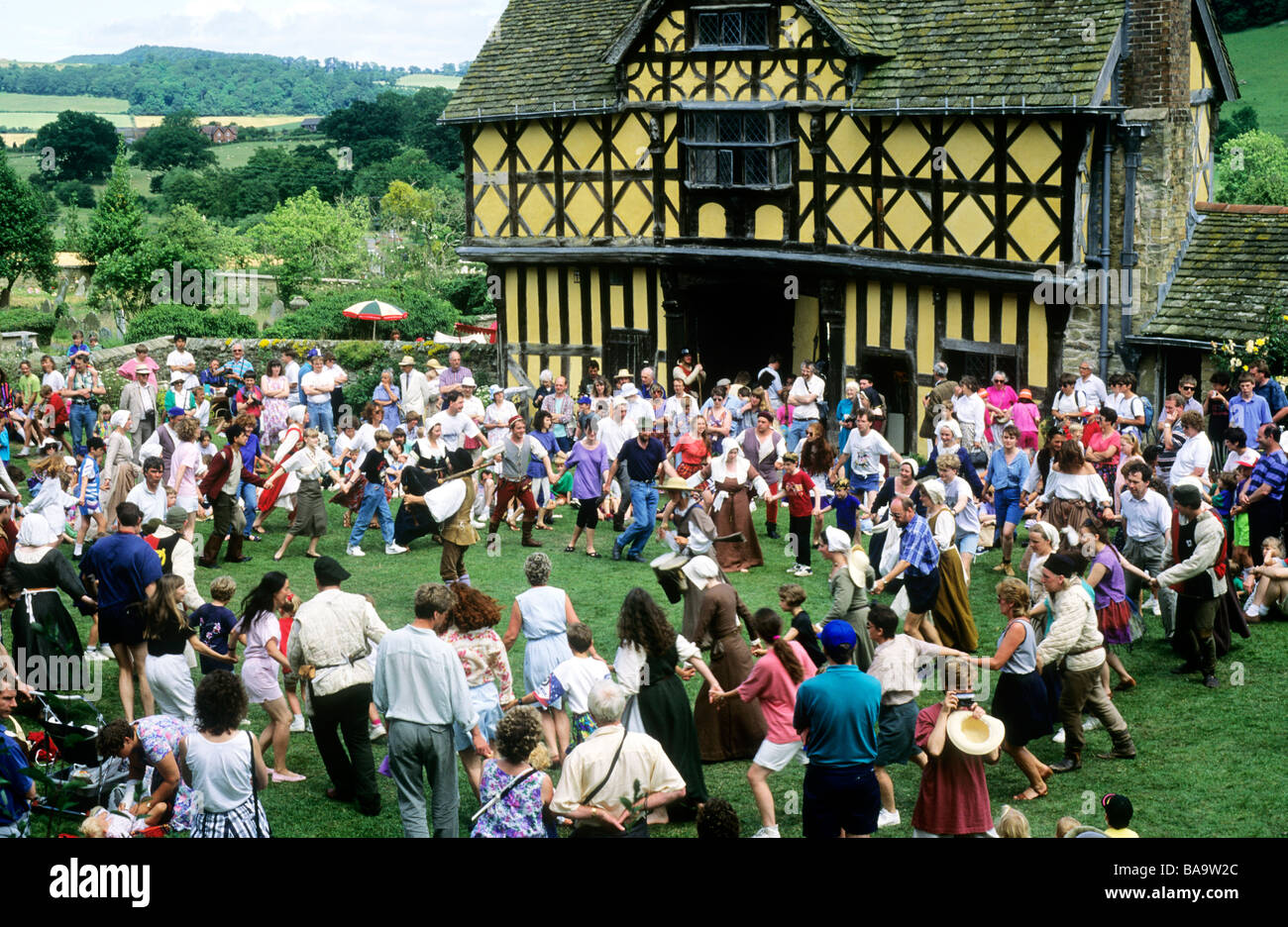 Audience participation Medieval re enactment Stokesay Castle mass brawl dance music musiciand costume visitors fun enjoyment Stock Photo