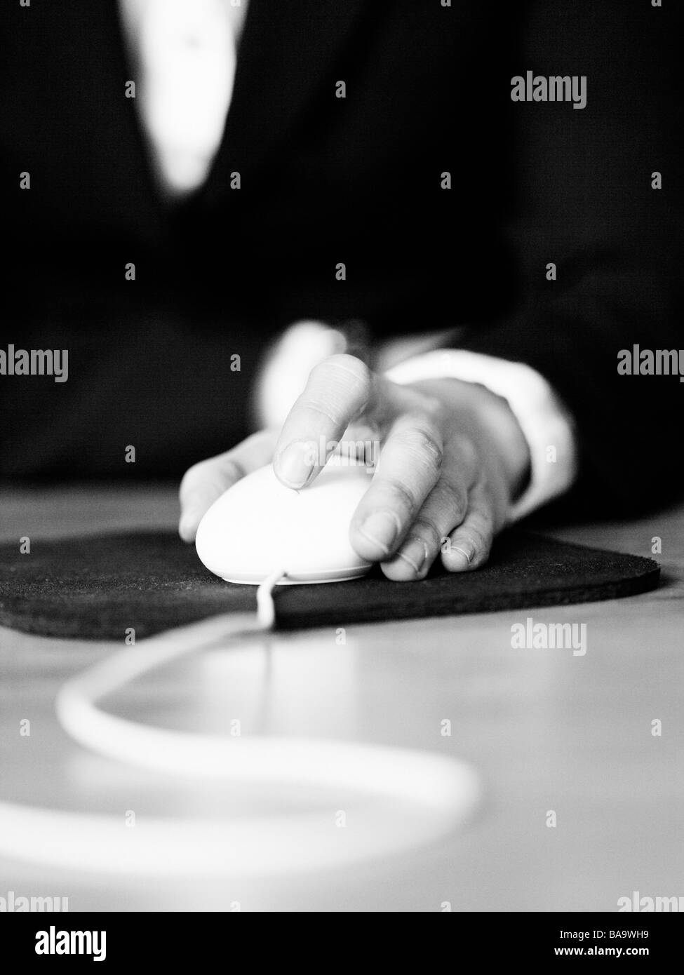 A hand with a mouse, Swedn. Stock Photo