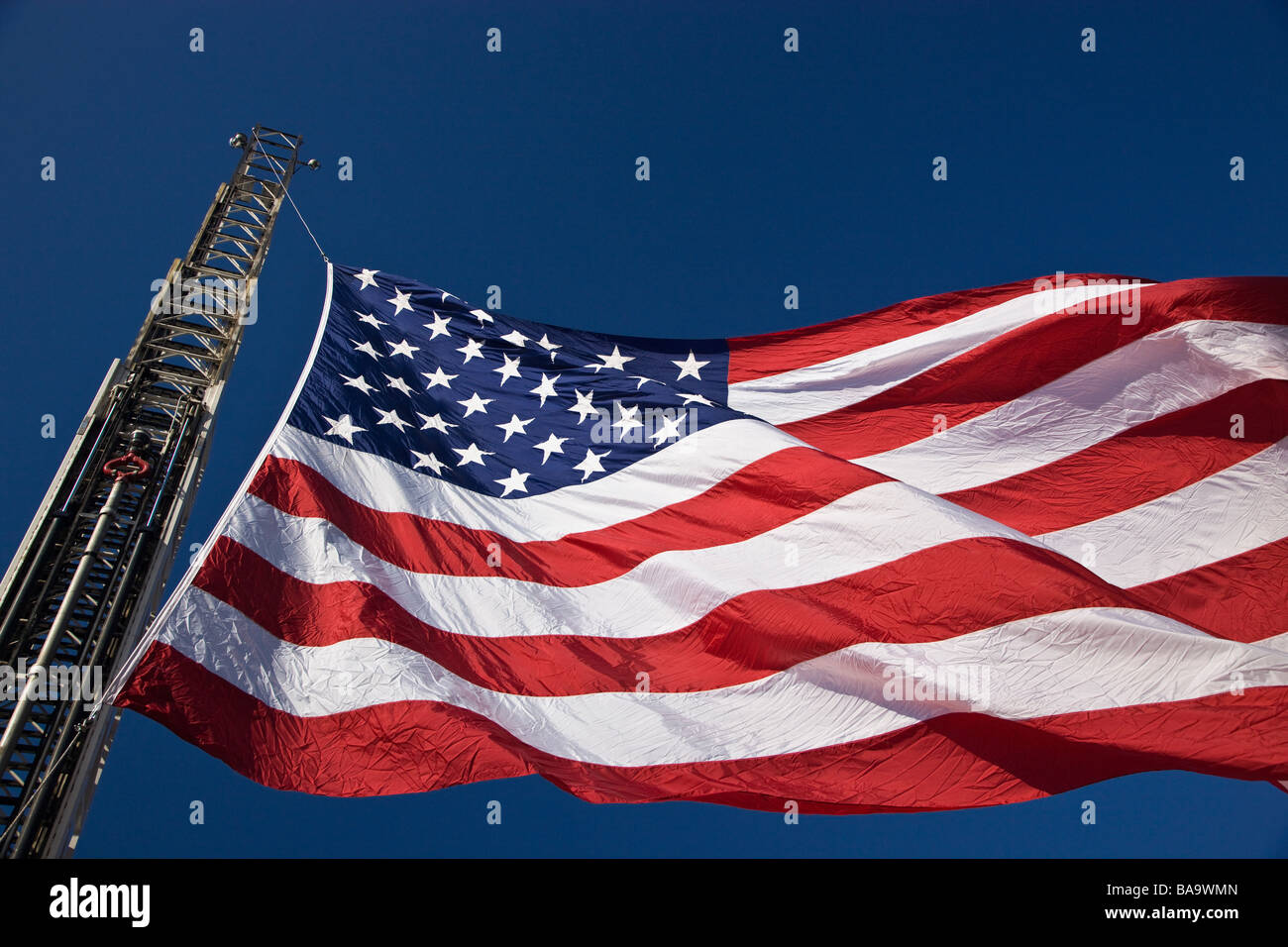 United States flag against a blue sky Stock Photo - Alamy