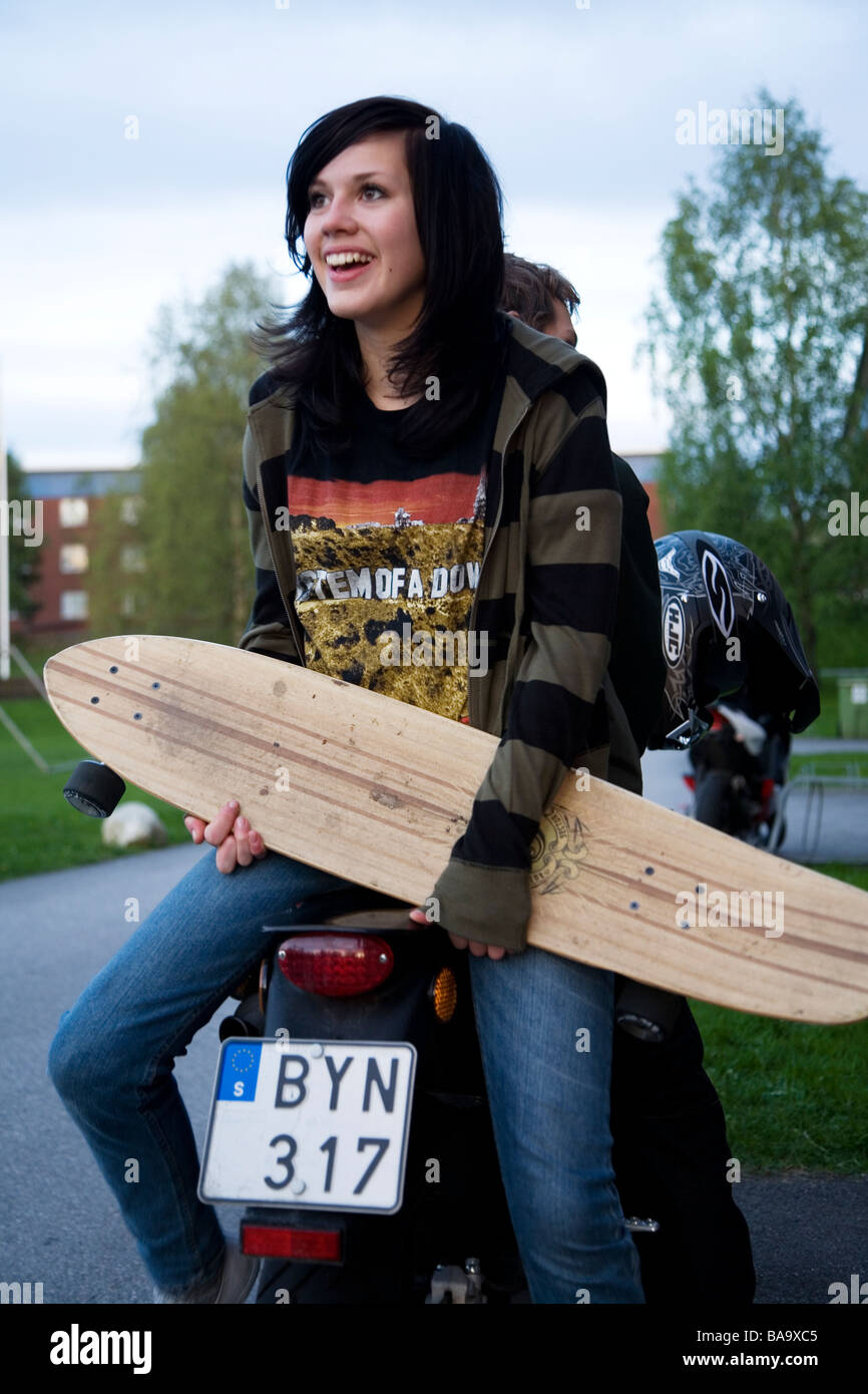 A teenage girl with a skateboard, Sweden Stock Photo - Alamy