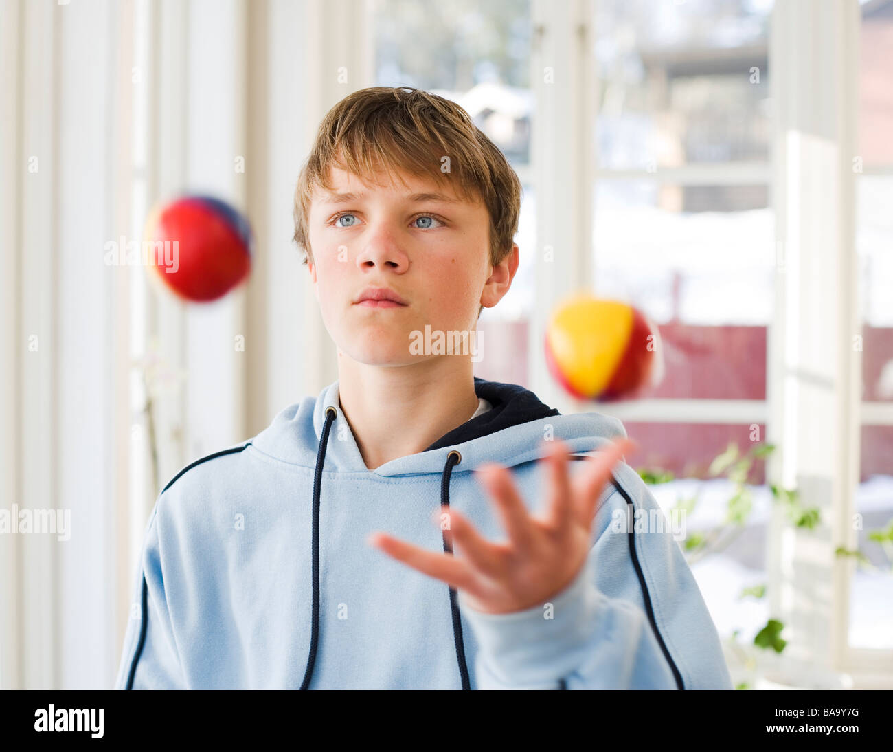 A boy juggling, Sweden. Stock Photo