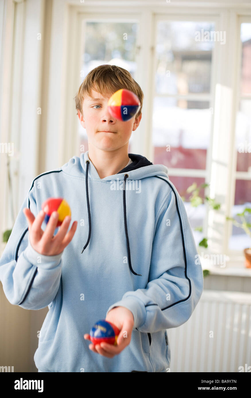 A boy juggling, Sweden. Stock Photo
