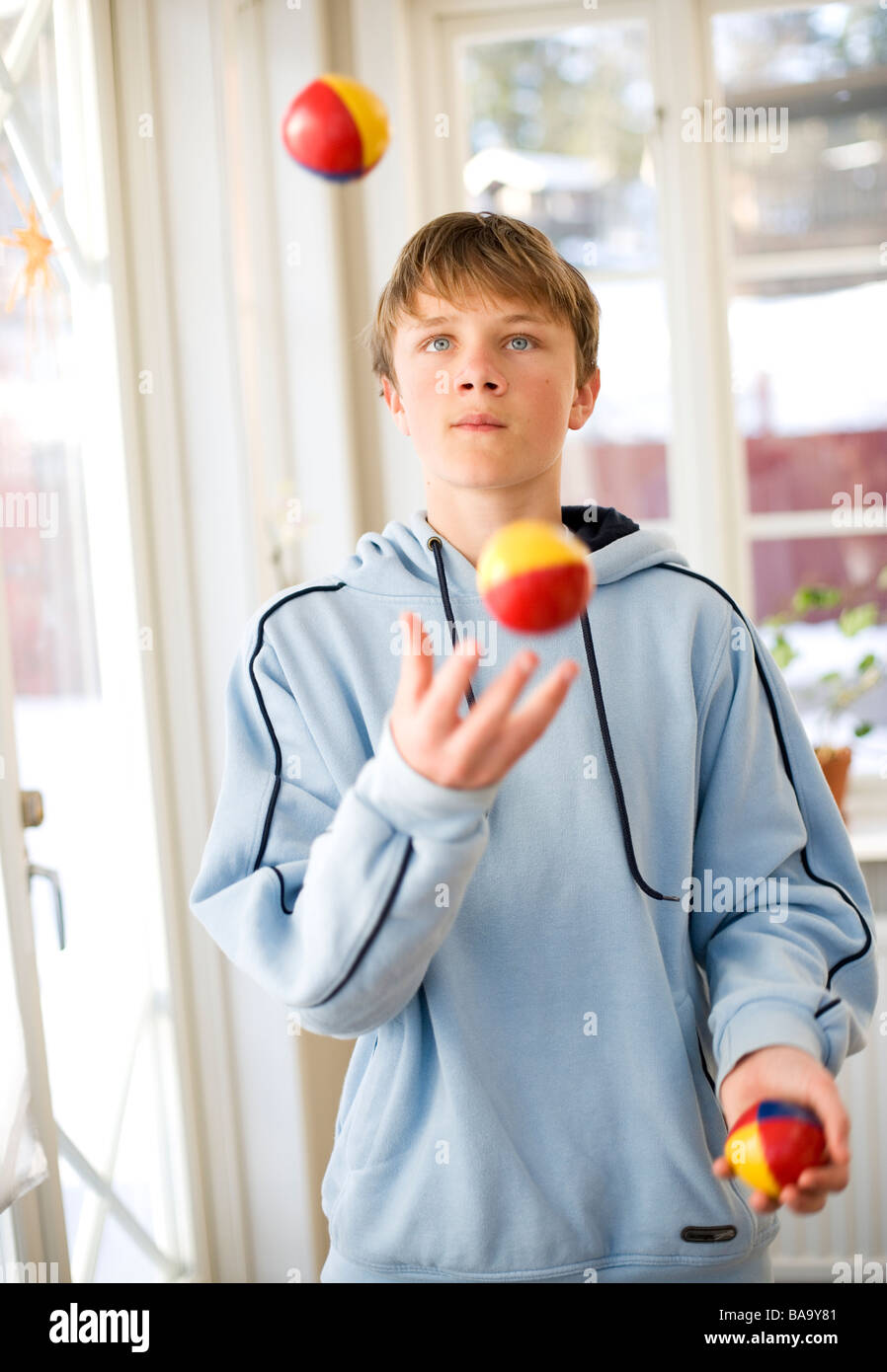 A boy juggling, Sweden. Stock Photo