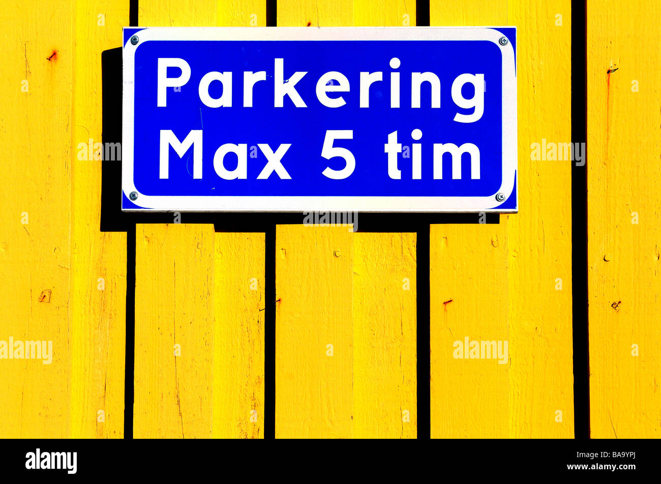 A parking sign on a yellow wall. Sweden Stock Photo Alamy