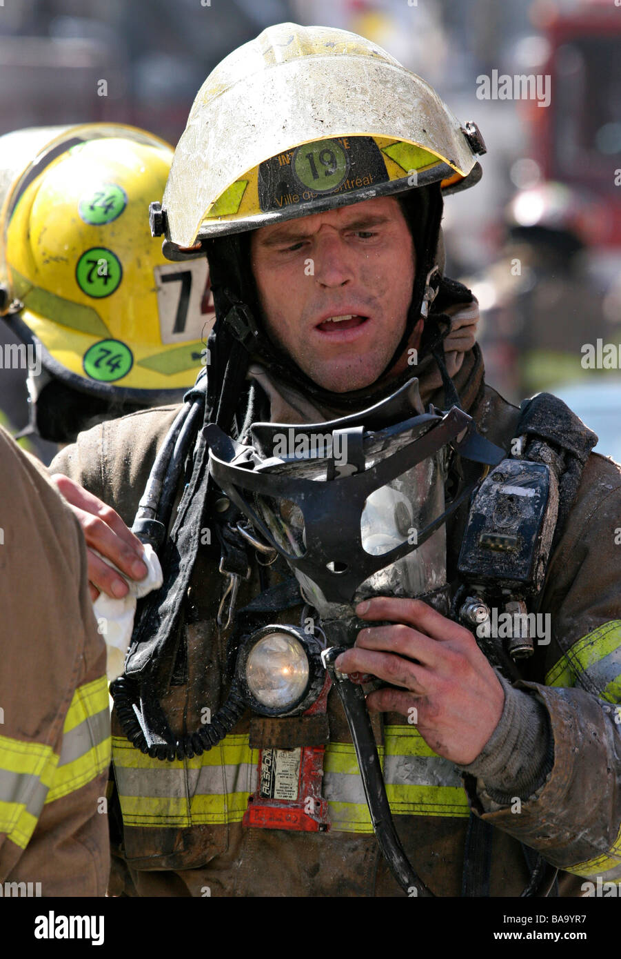Montreal firefighter cleaning his oxygen mask Stock Photo