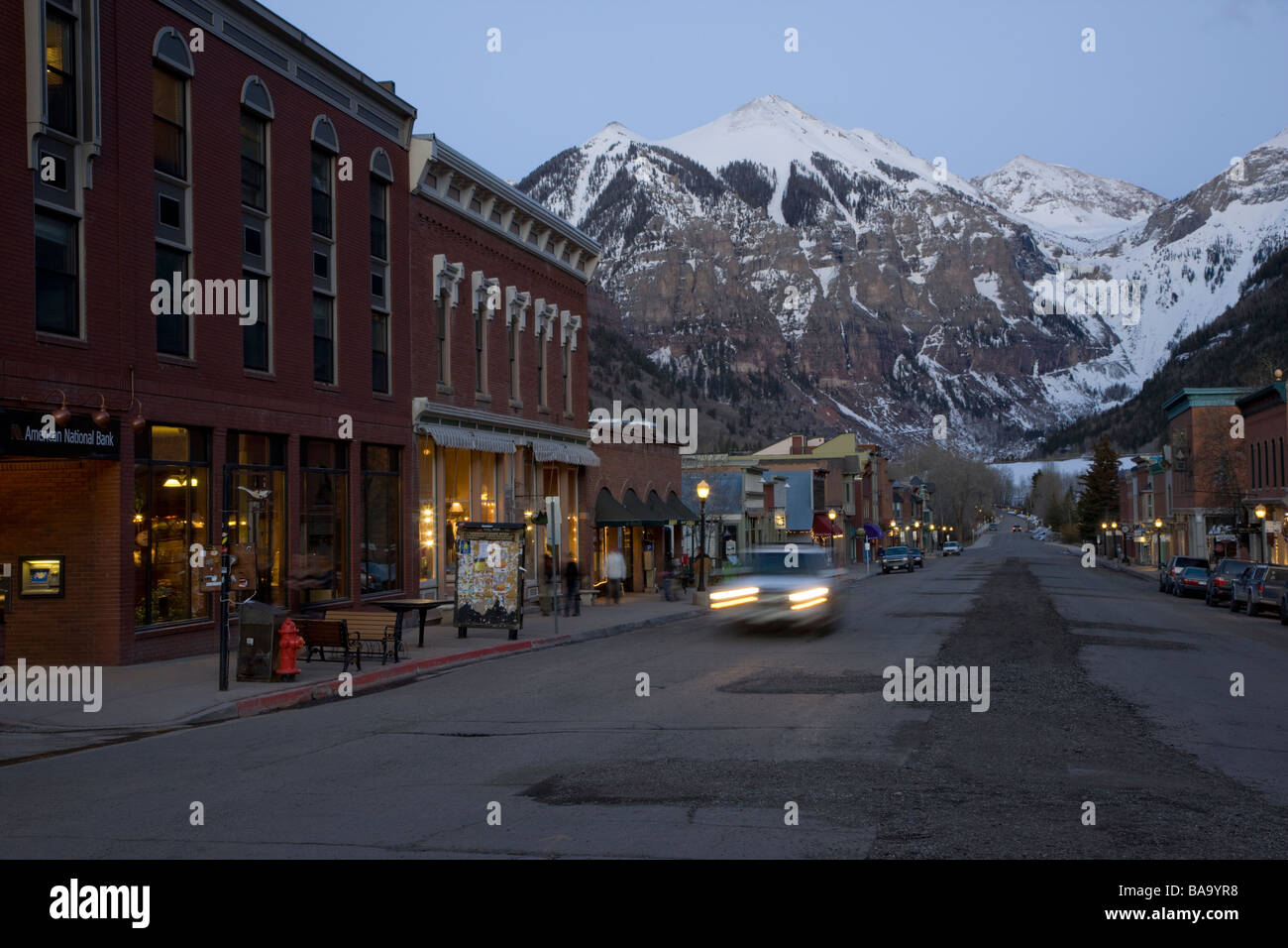 Late winter dusk view of the main street in historic town of Telluride Colorado USA home to a major ski resort Stock Photo