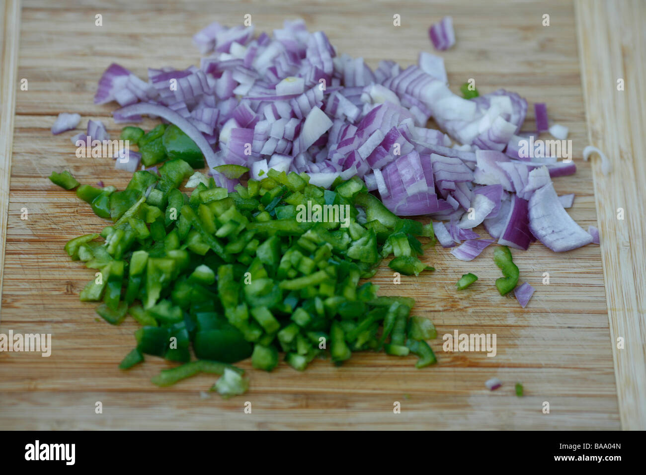 red onion and green peper chopped and ready for the pot Stock Photo