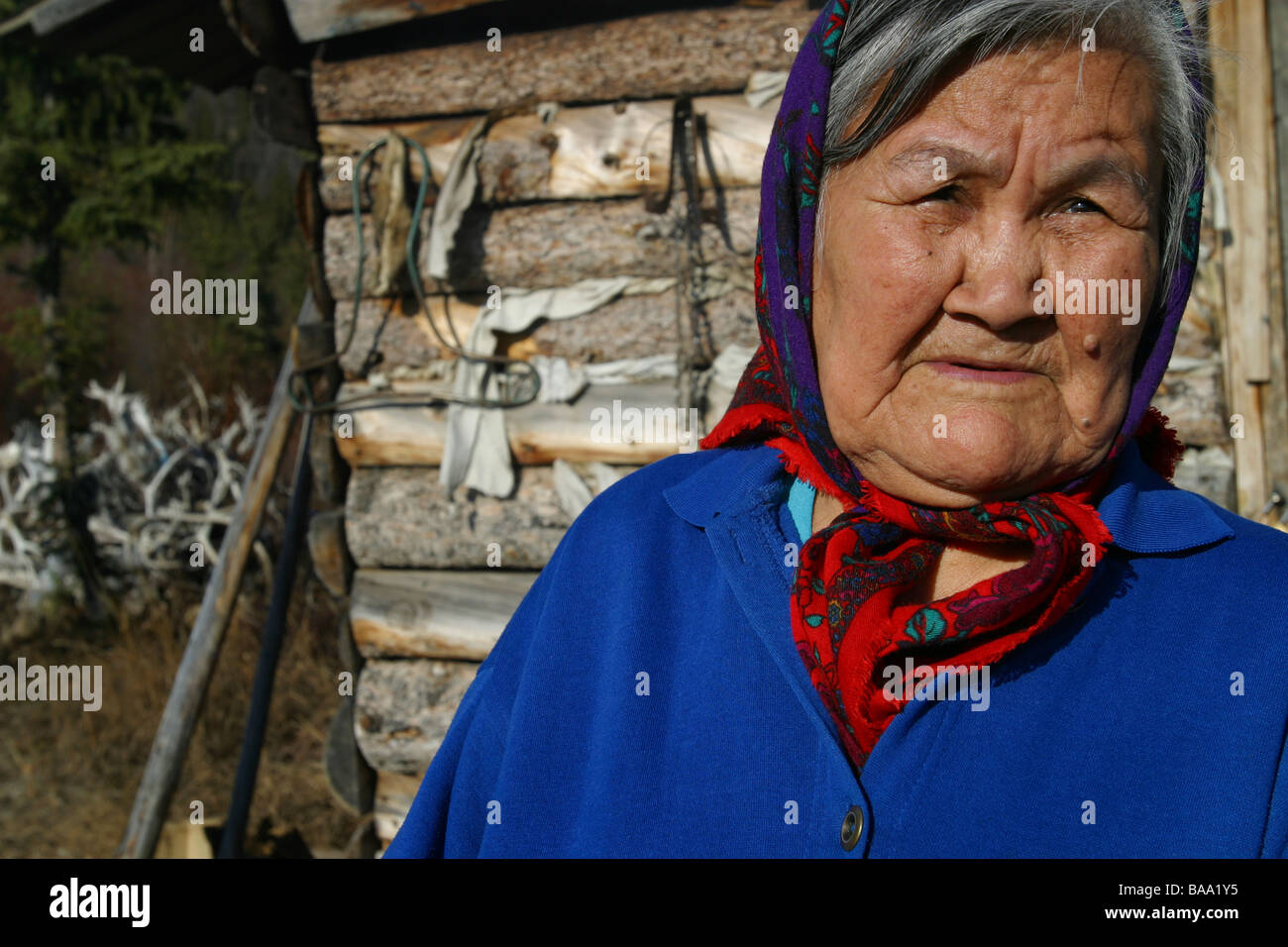 A First Nations female elder wears a head scarf in the community of Old  Crow, Yukon Territory, Canada Stock Photo - Alamy